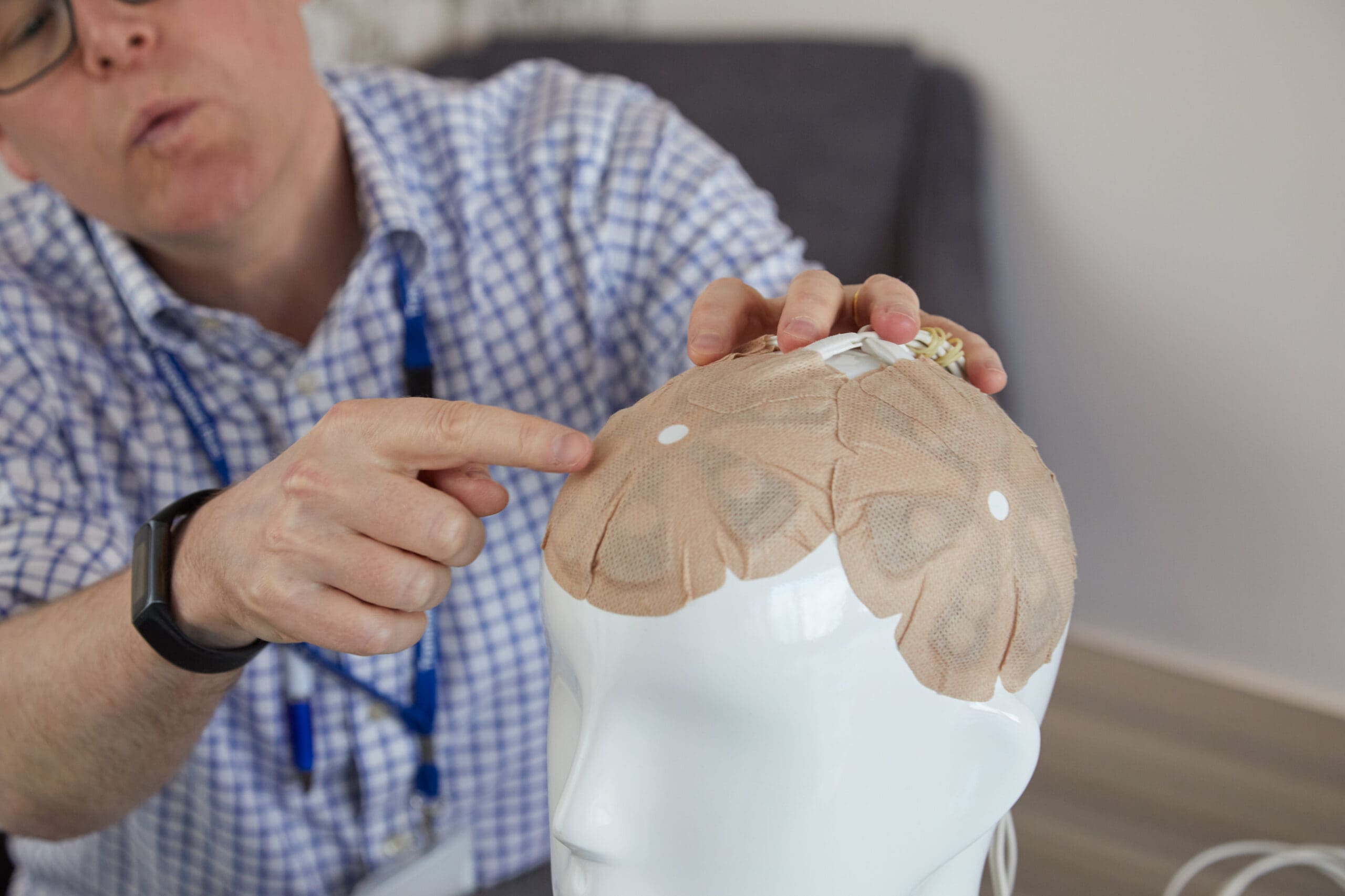 Dr Matt Williams discussing Optune treatment with a patient